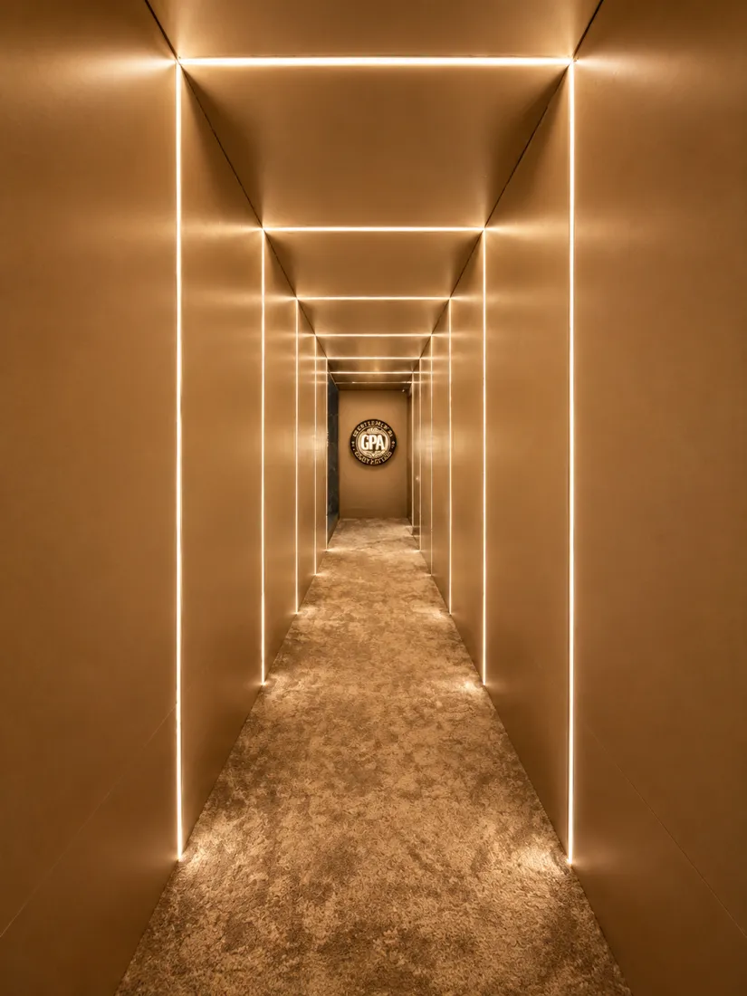 The felt, the chips and the lamp-lit room at Grand Poker Arena